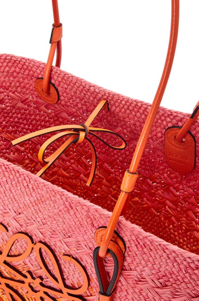 Bolso Tote Loewe Anagram Basket bag in iraca palm and calfskin Mujer Rosas Naranjas | 196TWXKHS